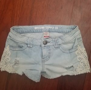 Mildly distressed shorts with lace accents
